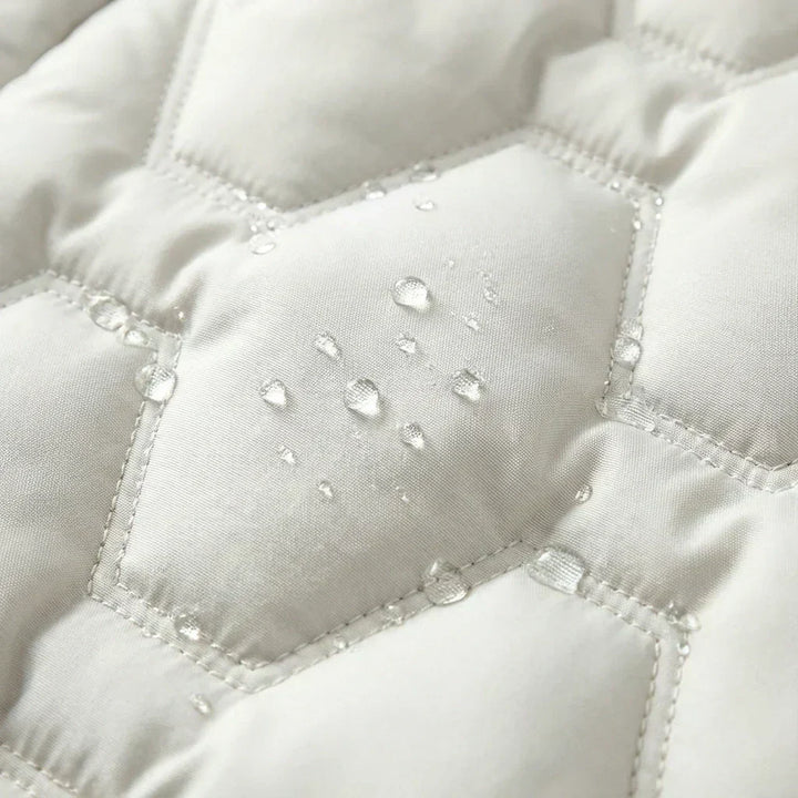 Doudoune Longue Matelassée à Capuche Femme
